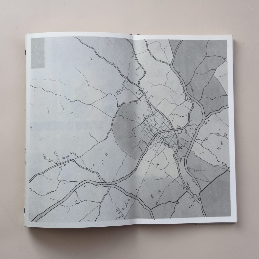 Collaborative art booklet with muted greys and a hand-drawn map aesthetic